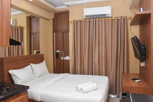 Good Choice Studio at Green Pramuka Apartment near Shopping Center By Travelio