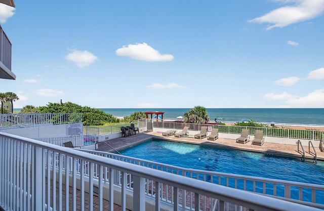 Ground floor direct oceanfront condo with a private poolside balcony and garage parking