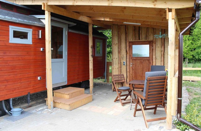 Historic circus wagon in idyllic landscape and tranquility