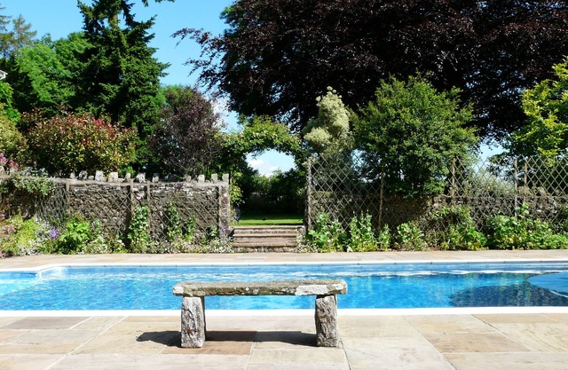 Holiday cottage with use of owners' swimming pool and tennis court
