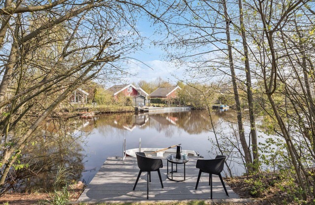 Holiday home on a small lake with jetty and garden