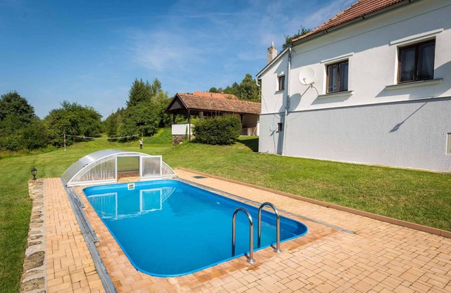 Holiday home with outdoor swimming pool