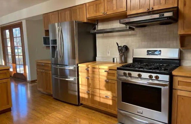 Home in the heart of Kenai on 2 wooded acres across from city park!