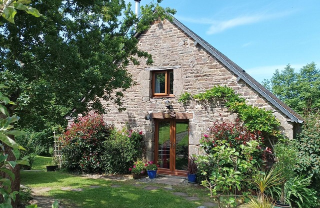 Idealy located converted old mill to a gite with a games room by a river.