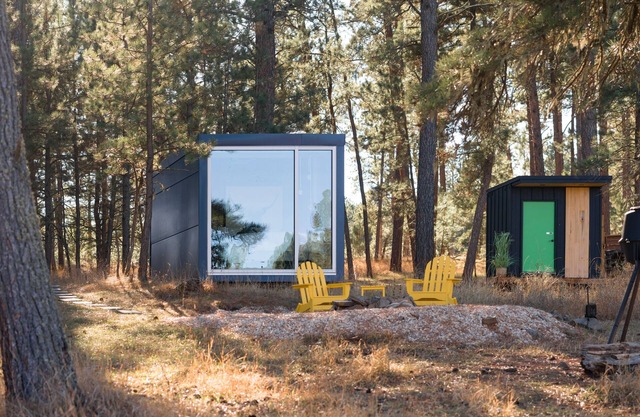 Industrial, modern micro cabin in the forest