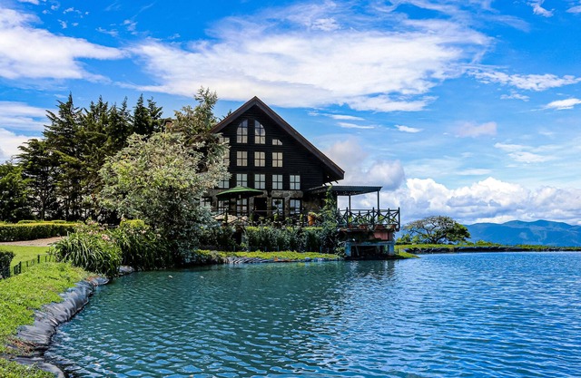 Inviting dog-friendly home with lake, hot tub, game room, fireplace, & W/D