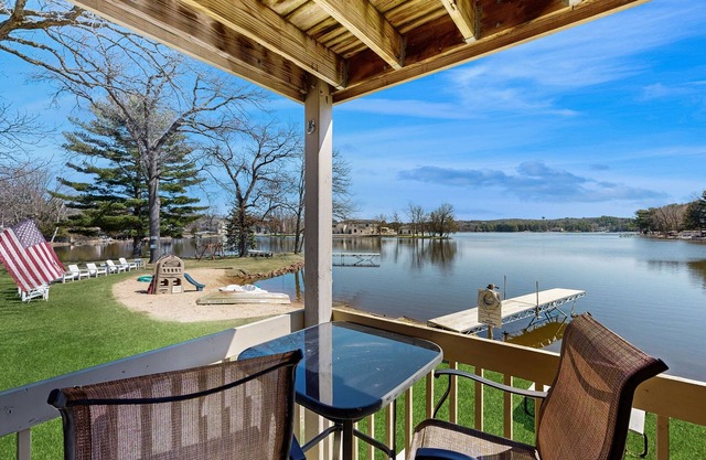 Inviting lakefront condo - amazing views, beach access, fireplace, dock, AC, W/D