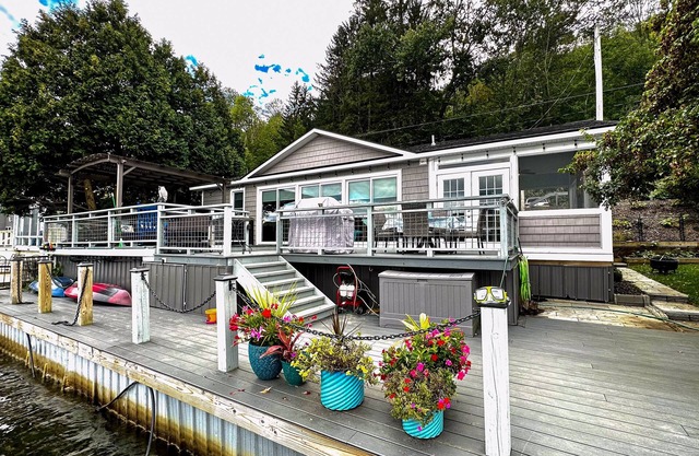 Lakefront home with private dock, lake views, kayaks, grill, large covered deck