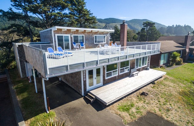 Large Deck at this Oceanfront home with Views of Twin Rocks, Beach and Lake