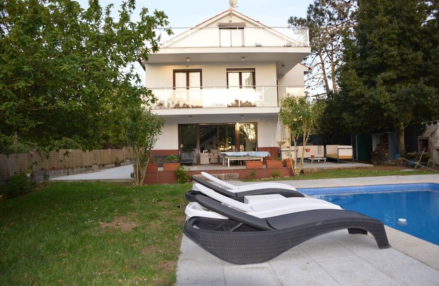 Large house with pool, beach and forest.