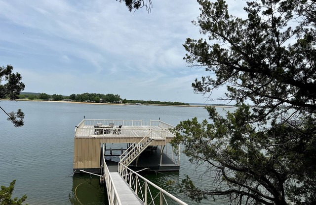 Large, shady patio with deep-water two-story dock with sunset views. Sleeps 8