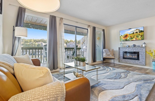 Light filled condo with balcony, water views, grill & shared amenities