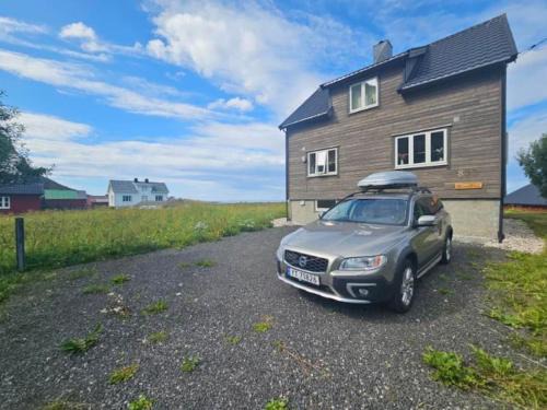 Lofoten midnight sun spot house on the beach
