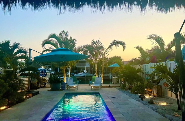 Luxurious Waterfront Oasis: 2BR, Private Heated Pool, Tiki, Dock