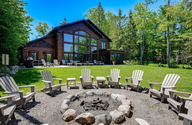 Luxury lakefront home with high-speed WiFi, dock, private beach, & theater room