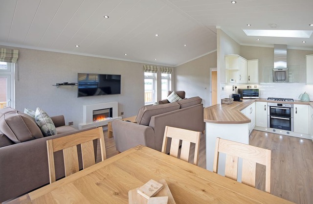 Luxury lodge with one double with en suite shower and two twin.
