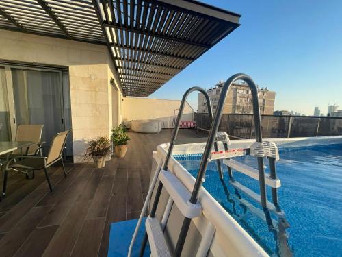 luxury penthouse with a jaccuzi, pool and parking