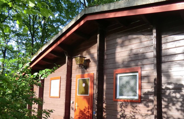 Lying on a peninsula holiday home in Swiss Cottage style