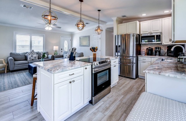 Mermaid Hideaway: Charming 2BR Canal Front Home with Pool, Tiki, Dockage, and Dog-Friendly Amenities