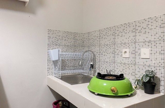Minimalist And Cozy 1BR at Royal Heights Apartment