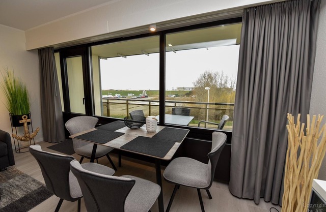 Modern 1-room lake view apartment on the 2nd floor with balcony