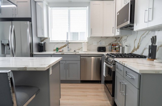 MODERN 3-4 BR TOWNHOME BUILT 2023 w/OFFICE, BONUS ROOM, GARAGE & EV CHARGER p64