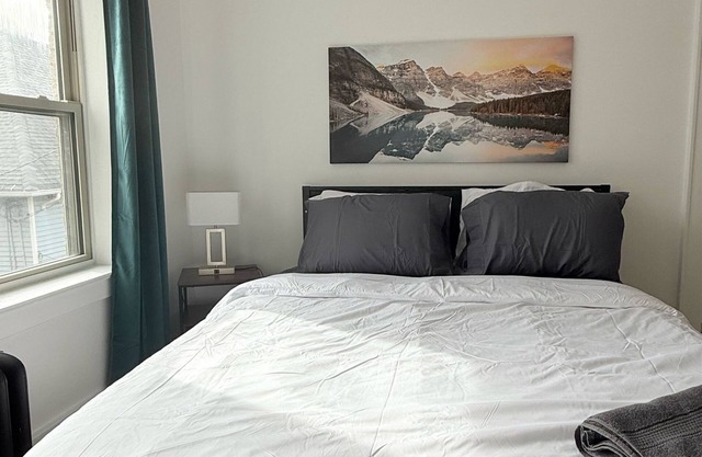 Modern studio in Downtown Rochester with a full kitchen and Smart TV, steps from High Falls.