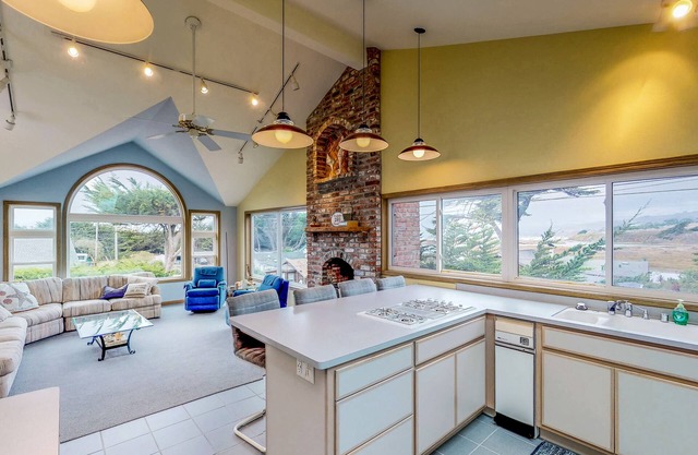 Ocean view home with private sauna, fireplace, balcony & W/D - walk to beach