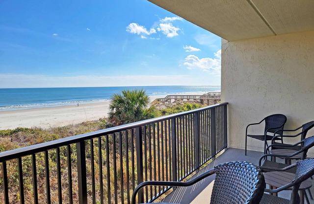 Oceanfront 2-story condo, main floor balcony view, direct beach access, pool