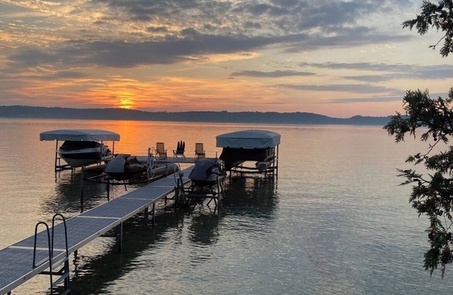 ON TORCH LAKE! Fall Colors are beautiful reflection off of Torch Lake