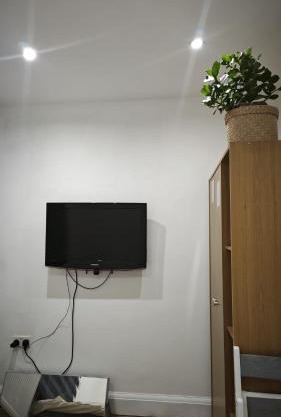 Private guest suite inside a family home with own entrance, kitchen, and bathroom