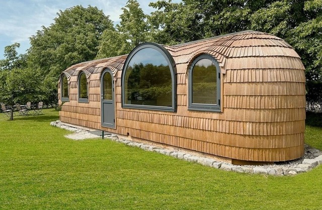 Pure feeling of nature in a sustainable wooden igloo house with gym and pool