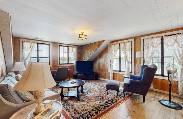 Quintessential lakefront home with woodstove, beach access, dock & washer/dryer