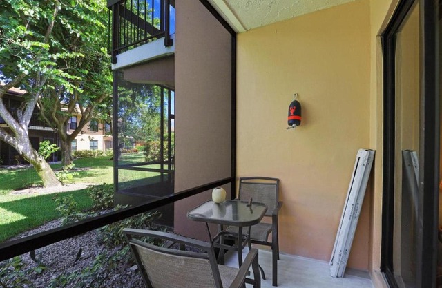 Relaxing condo with two pools and steps to beach