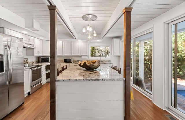 Renovated in 2022, 5BR, heated pool, firepit, lush backyard character & charm!
