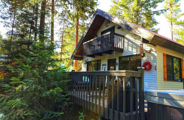 River view, large outdoor living with hot tub, fire pit, grill and pizza oven!