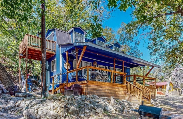 Riverside Retreat with outside dining area, deck and internet