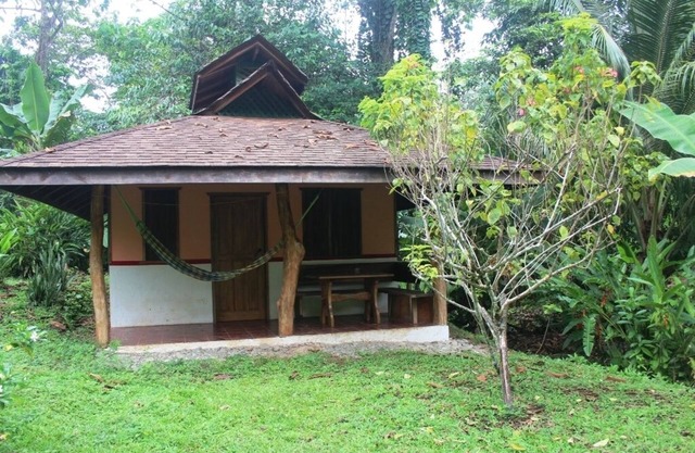 Romantic bungalow in the middle of a tropical garden, close to the beach.