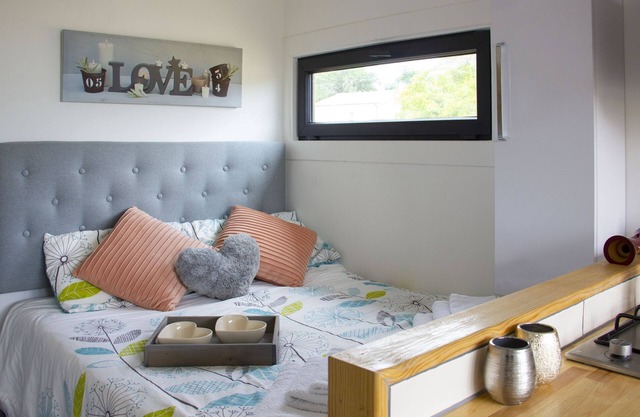 Romantic converted shipping container with outdoor bath