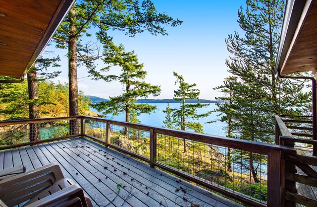Rustic waterfront cabin w/free WiFi, a full kitchen, & furnished decks