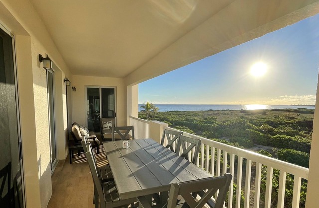 Seas the Day TCI covered balcony, patio dining, gated entrance, on site security