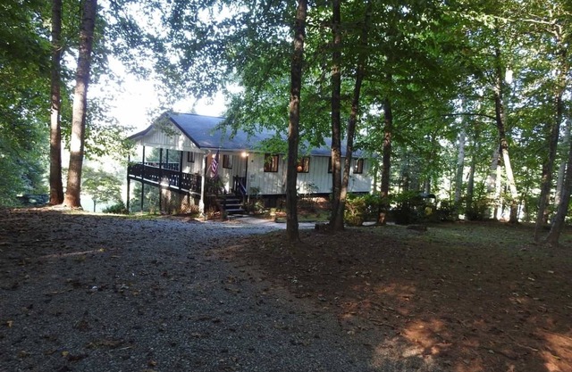 Serene and secluded mountain side retreat home next to The French Broad River.