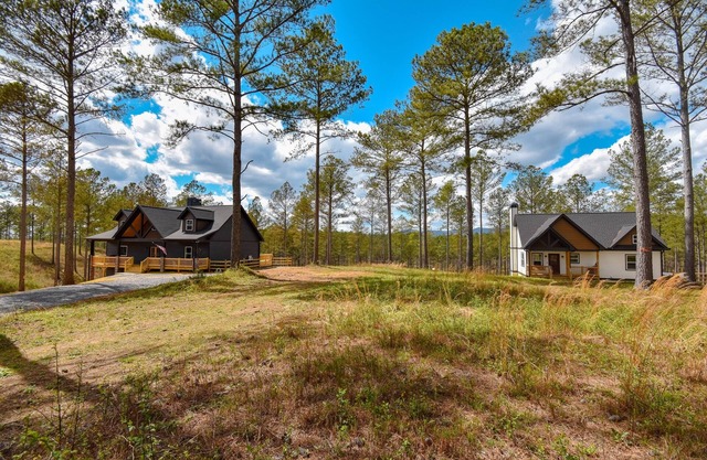 Side-by-side mountain cabins with hot tubs, views, & ample entertainment space