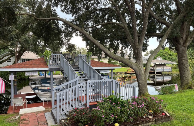 Spacious home directly on Lake Grassy canal. Boat house, hot tub & pool table
