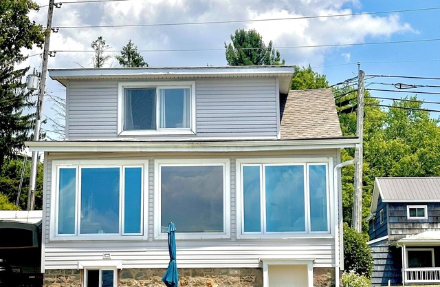 Spacious lakefront home with private dock and a panoramic view of Conneaut Lake.