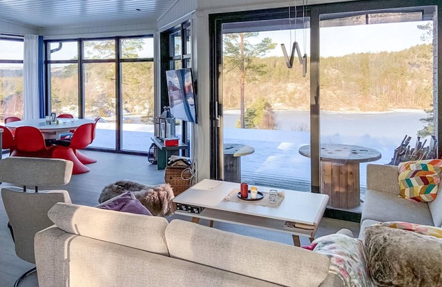 Spend an idyllic island vacation in this enchanting vacation home by the fjord.