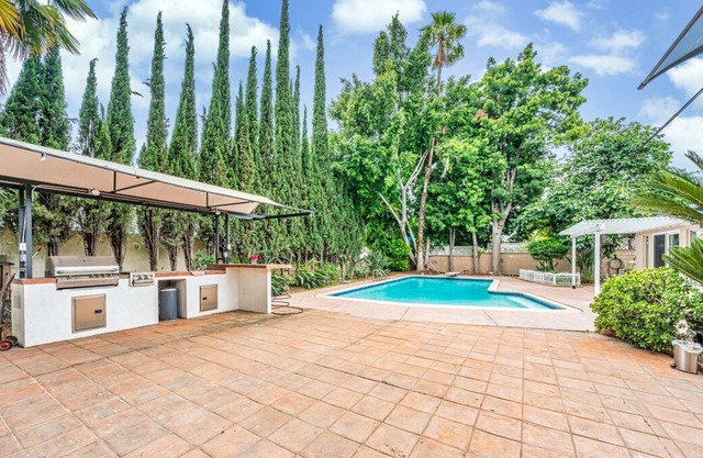 studio with pool and bbq grill