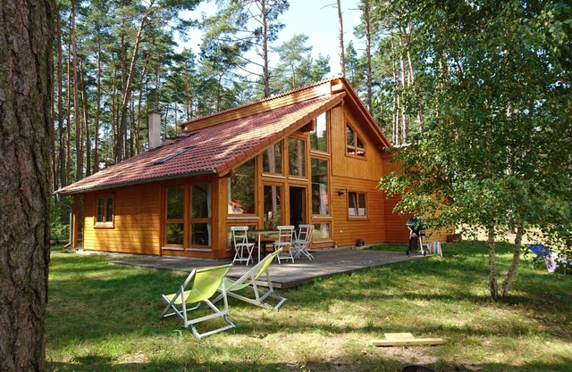 Stylish, bright wooden house by the forest in the immediate vicinity of a clear bathing lake
