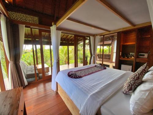 Suite Room with AC ,surrounded by ricefield By iLys Collection