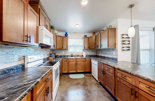 Sunny and updated home with workspace, beach gear, games, and firepit